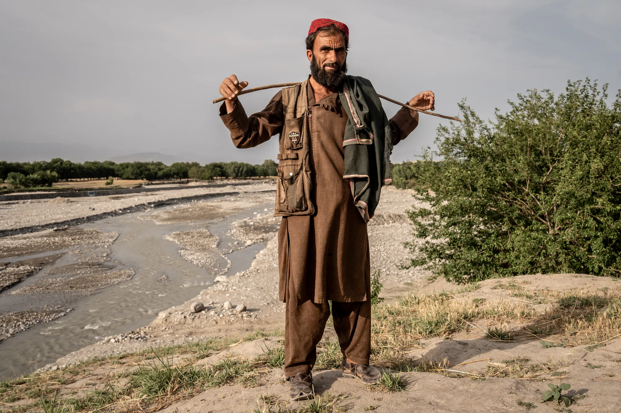 Shepherd Noor Jan from Mufti Qala village, Afghanistan. Built after years of seasonal flooding, a new protection wall will protect homes, farms and the livelihoods of families in his village.