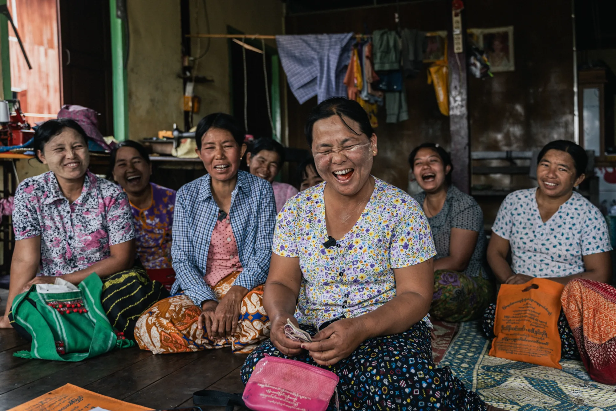Women laugh together during a livelihood group meeting in Nyaungshwe Township, Myanmar. After the 2025 earthquake, they are regaining their income through farming, saving together and investing in new opportunities for their families.